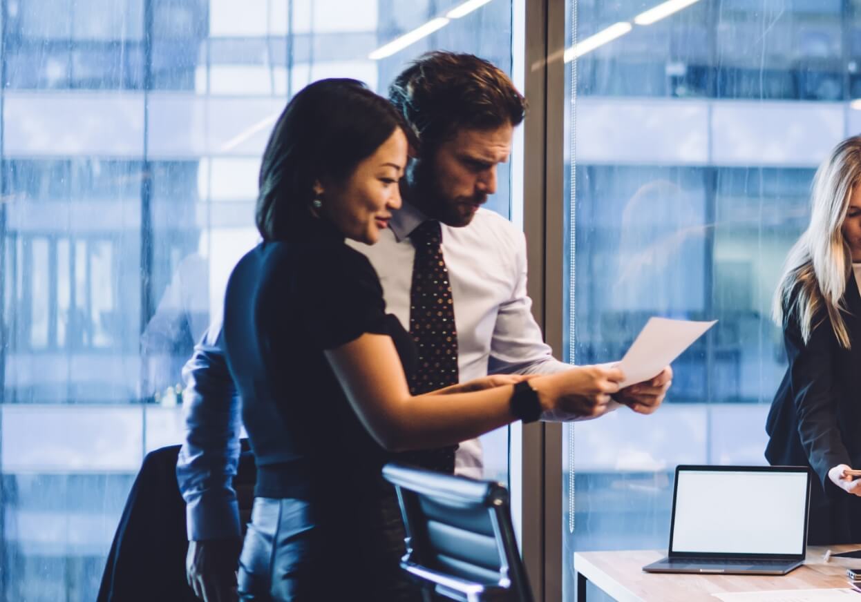 Colleagues discussing business information